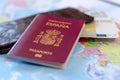 Spanish travel passport on the wallet with euro cash
