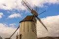 Spanish windmill made of stone with blue sky