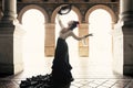 Spanish woman dancing flamenco dance in a beautiful monumental place Royalty Free Stock Photo