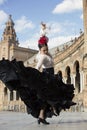 Spanish woman dancing flamenco dance in a beautiful monumental place Royalty Free Stock Photo