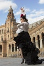 Spanish woman dancing flamenco dance in a beautiful monumental place Royalty Free Stock Photo