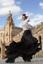 Spanish woman dancing flamenco dance in a beautiful monumental place Royalty Free Stock Photo