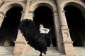 Spanish woman dancing flamenco dance in a beautiful monumental place Royalty Free Stock Photo