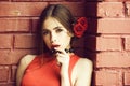 Spanish woman with fashionable makeup and rose flower in hair Royalty Free Stock Photo
