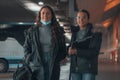 Spanish women in black coat at a bus station Royalty Free Stock Photo