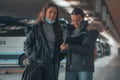 Spanish women in black coat at a bus station Royalty Free Stock Photo