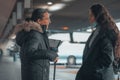 Spanish women in black coat at a bus station Royalty Free Stock Photo