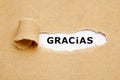 Spanish Word Gracias Ripped Paper Concept