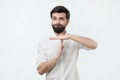 Spanish young man with black beard making time out gesture Royalty Free Stock Photo