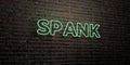 SPANK -Realistic Neon Sign on Brick Wall background - 3D rendered royalty free stock image