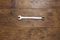 Spanner on rustic wood background