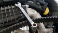 Spanner and timing belt on car engine Royalty Free Stock Photo