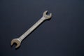 Spanner wrench on black background, Open box wrench chrome engineering instrument Royalty Free Stock Photo