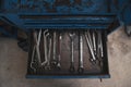 Spanners tools in an open drawer of old blue toolbox Royalty Free Stock Photo
