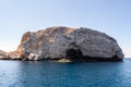 Spanopoula Rock on north tip of Kea Island, Cyclades, Greece, white limestone rock island, diving and snorkeling spot Royalty Free Stock Photo