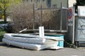 Spare furniture pieces and mattresses piled at the place for trash bins in residential quarter