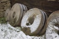 Spare millstones leaning against wall of mill Royalty Free Stock Photo