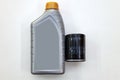 Spare part for car engine filter for cleaning dust and dirt with one liter bottle or can of lubricant on a white isolated