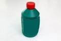 Spare part for car stop system brake fluid one liter bottle in green color with red cap on a white isolated background. Royalty Free Stock Photo