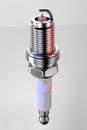 Spare part spark plug on white background for car and motorcycle. 3D rendering Royalty Free Stock Photo