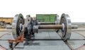 Spare railway wheels on the axle in a repair workshop on isolate