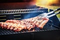 Spare ribs cooking on barbecue grill for summer outdoor party. F Royalty Free Stock Photo