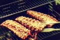 Spare ribs cooking on barbecue grill for summer outdoor party. F