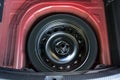 Spare wheel in the trunk of a modern car Royalty Free Stock Photo