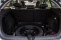 Spare wheel in the trunk of a modern car. Royalty Free Stock Photo