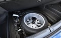 Spare wheel in the trunk of a modern car Royalty Free Stock Photo