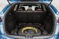 Spare wheel in the trunk of a modern car. Royalty Free Stock Photo