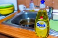 Spark dishwashing liquid on kitchen sink, shallow depth of field, space for text. Royalty Free Stock Photo