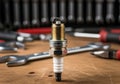 Spark plug and mechanic tools on wooden table ready for automotive repair work Royalty Free Stock Photo