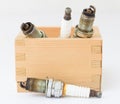 Spark plug in wood box Royalty Free Stock Photo