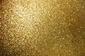 Sparkle glowing dark gold glitter of carborundum abstract textured background, can use for celebrate christmas day, new year day