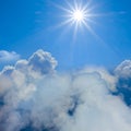 sun above a dense cumulus clouds Royalty Free Stock Photo