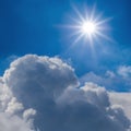 sparkle sun above a dense cumulus clouds Royalty Free Stock Photo