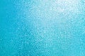 Sparkled glitter abstract texture. Beautiful christmas background in light blue colors. Defocused