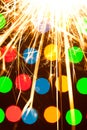 Sparkler background. A sparkler is a type of hand held firework that burns slowly while emitting colored flames, sparks Royalty Free Stock Photo