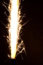 Sparkler background. A sparkler is a type of hand held firework that burns slowly while emitting colored flames, sparks Royalty Free Stock Photo