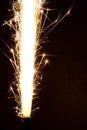 Sparkler background. A sparkler is a type of hand held firework that burns slowly while emitting colored flames, sparks Royalty Free Stock Photo