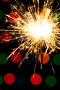 Sparkler background. A sparkler is a type of hand held firework that burns slowly while emitting colored flames, sparks Royalty Free Stock Photo