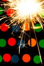 Sparkler background. A sparkler is a type of hand held firework that burns slowly while emitting colored flames, sparks Royalty Free Stock Photo