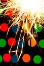 Sparkler background. A sparkler is a type of hand held firework that burns slowly while emitting colored flames, sparks Royalty Free Stock Photo