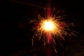 Sparkler on a black background on Christmas night. A lot of sparks from a Bengal fire. Sparkler close -up. Royalty Free Stock Photo