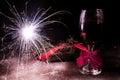 Sparkler and decorated wine glass for new year on wooden desk and snow Royalty Free Stock Photo