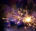 Sparkler fire in night with stars and nebula. Royalty Free Stock Photo