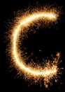 Sparkler firework light alphabet C on black Royalty Free Stock Photo