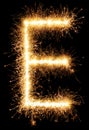 Sparkler firework light alphabet E on black Royalty Free Stock Photo