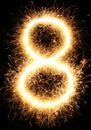 Sparkler firework light number 8 isolated on black Royalty Free Stock Photo